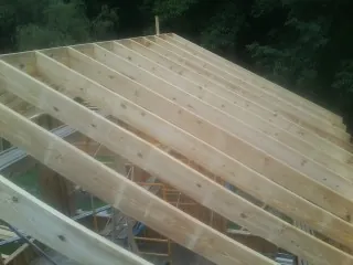 New roof rafters set over an addition before sheathing in Camp Pendleton